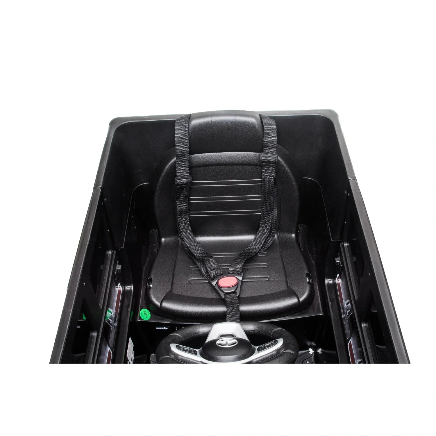 Black single seat with safety harness and Mercedes steering wheel inside a kids electric ride-on car body