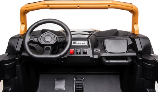 Interior dashboard and steering wheel of the Stinger Buggy XL 24V kids ride-on car with control buttons and foot pedals.