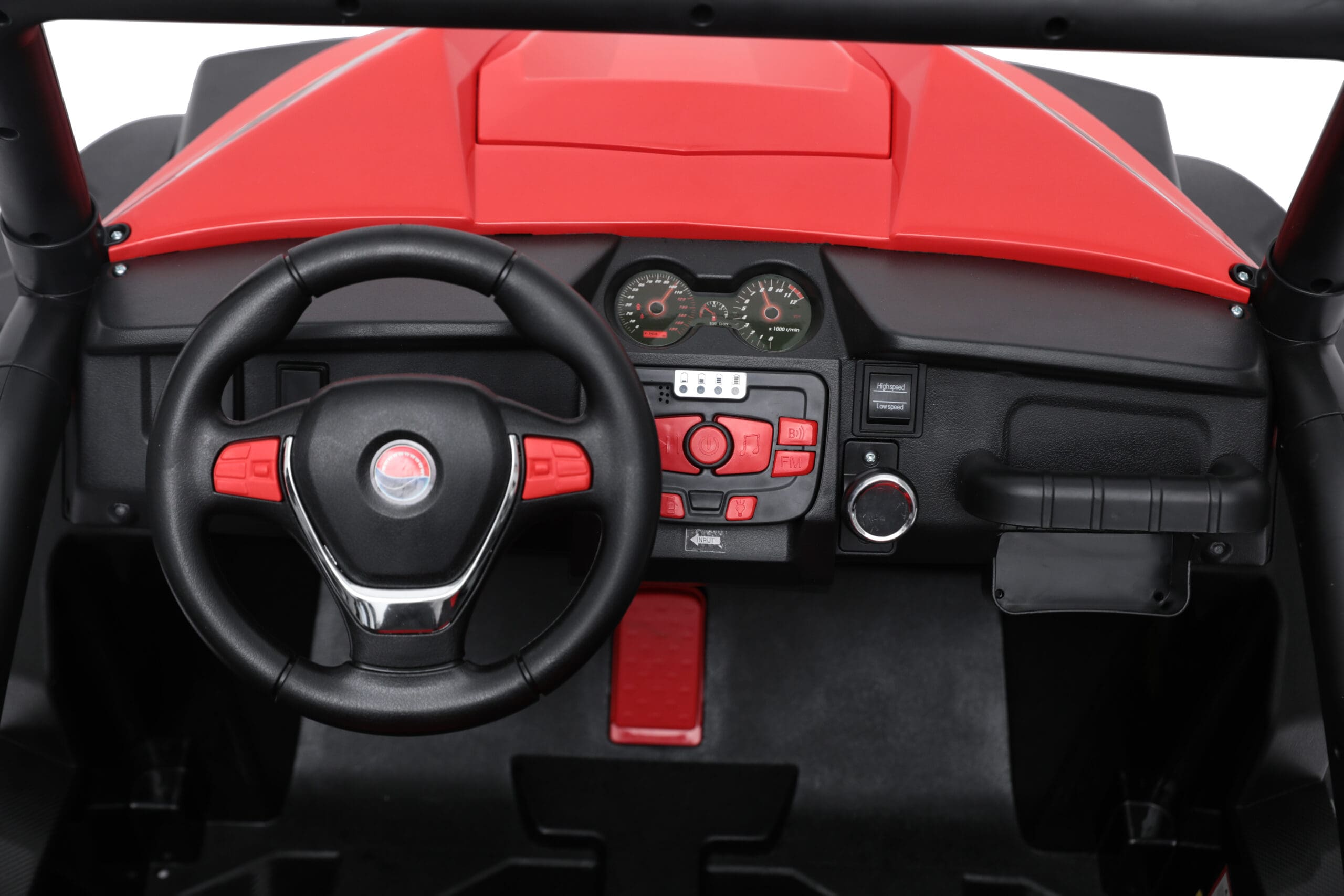 Interior dashboard and steering wheel of a red 24V kids ride-on buggy electric car with control buttons and pedals.