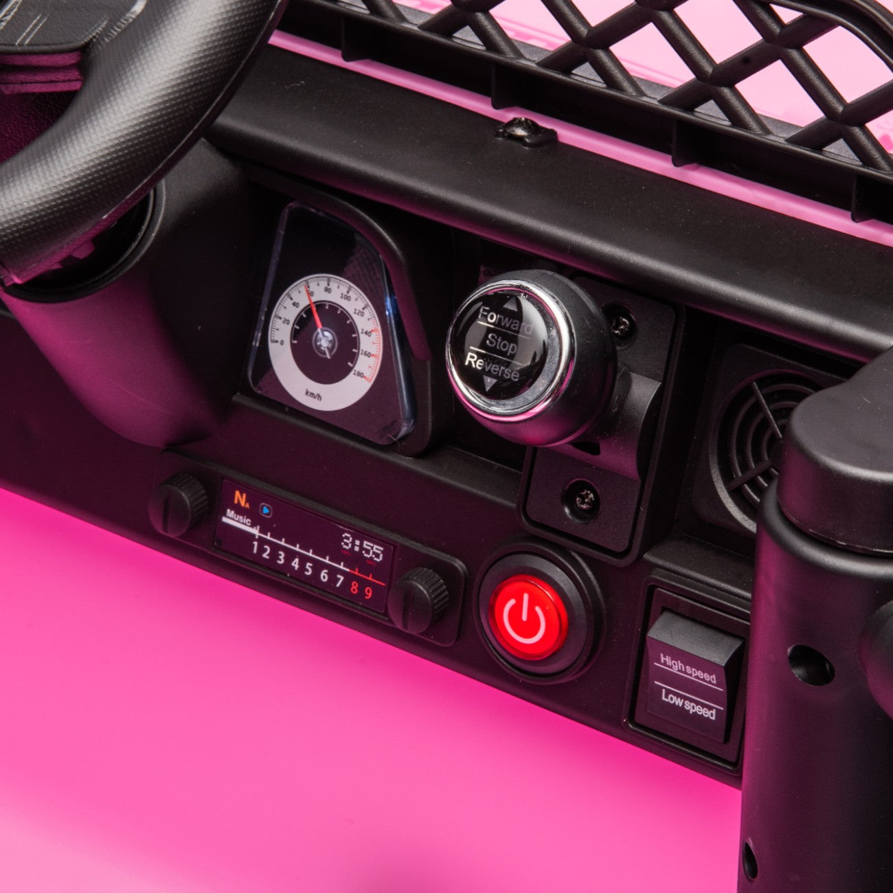 Dashboard and control panel of pink Toyota FJ Cruiser licensed electric toy car for kids with speedometer and power button.