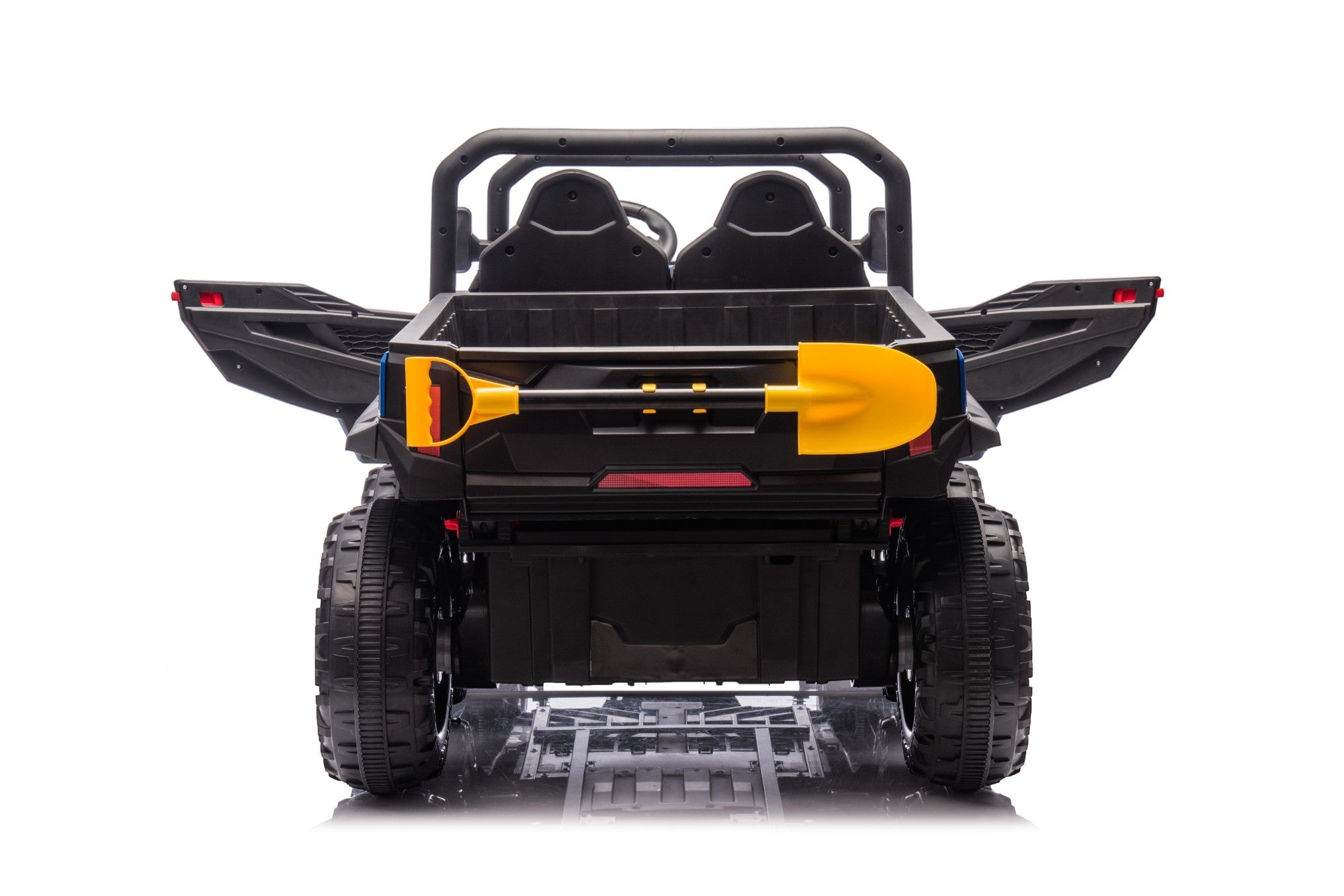 The MC Wholesalers 24V Blue Kids Ride-On Dump Truck – 6-Wheel Electric Tipper has two seats, large rear wheels, and a yellow toy shovel on the back. Shown from behind against a plain white background.