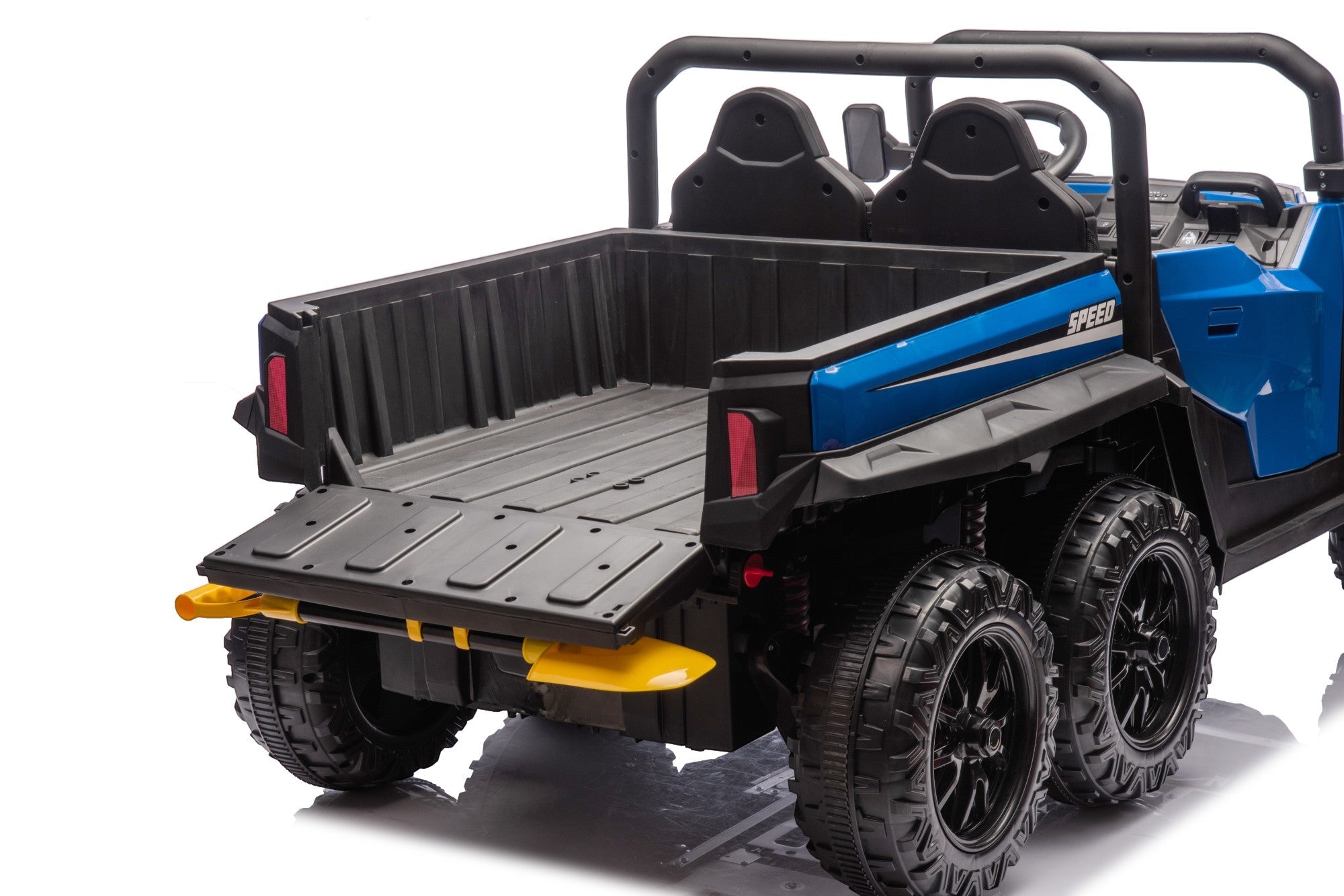The MC Wholesalers 24V Blue Kids Ride-On Dump Truck – 6-Wheel Electric Tipper is shown from the rear, highlighting its black cargo bed, open tailgate, two seats, and roll bar—ideal for adventurous play.