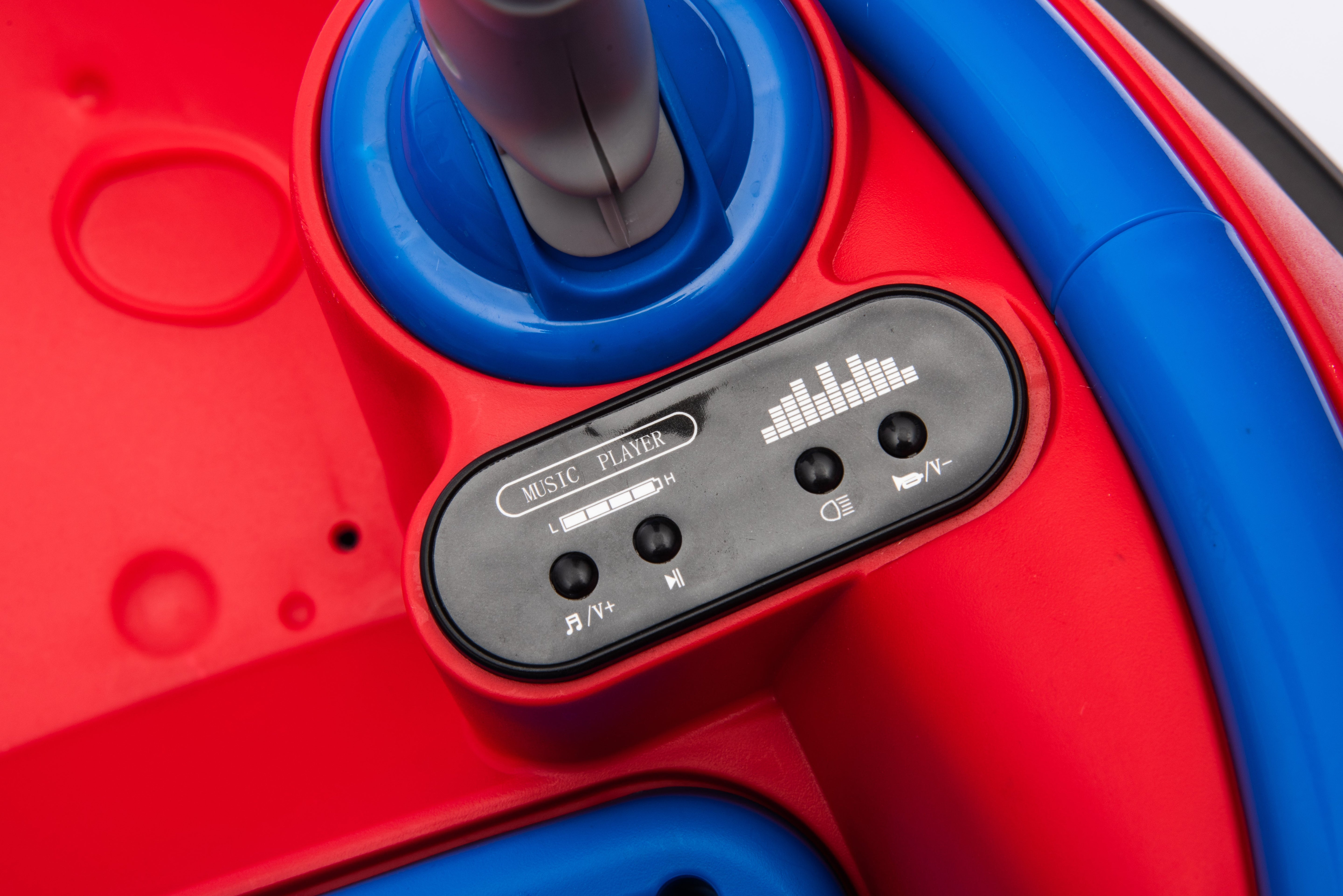 Close-up of the music player control panel on a red and blue 12V kids electric bumper car ride-on.