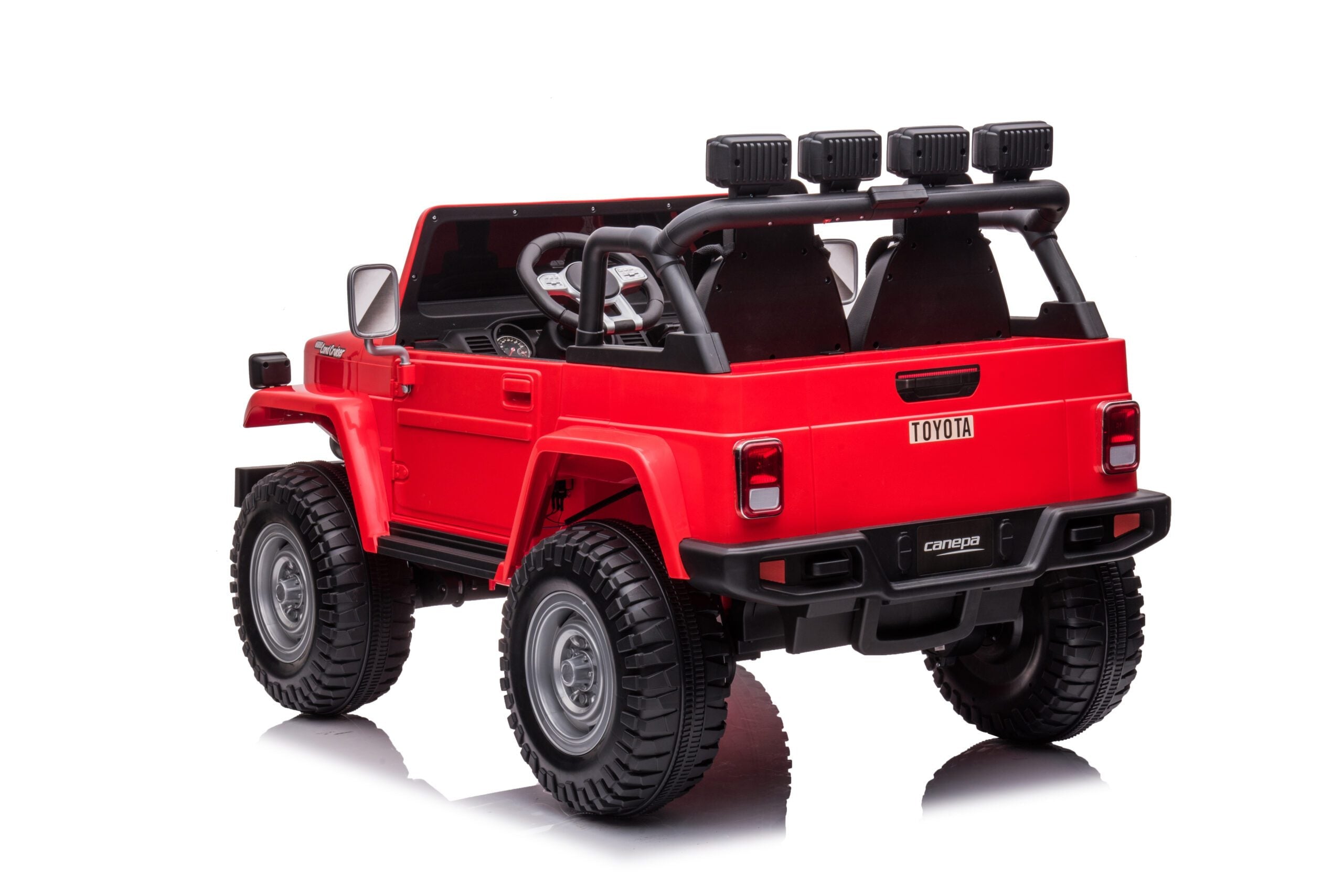 Red licensed Toyota FJ40 LandCruiser 24V kids ride-on SUV with 2 seats and 4WD, shown from rear angle on white background.