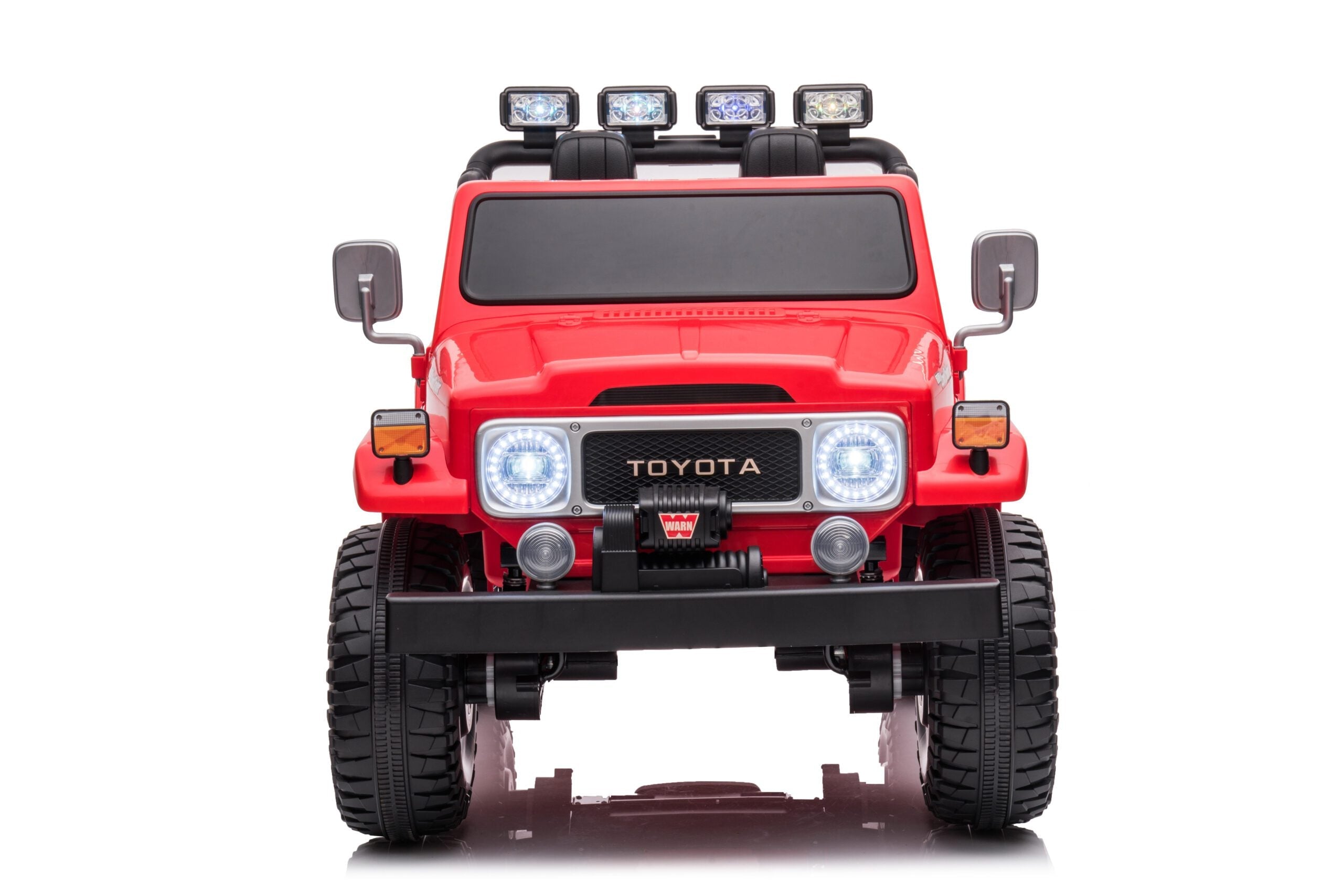 Red Licensed Toyota FJ40 LandCruiser 24V kids ride-on 4WD SUV with LED headlights and two seats, front view.
