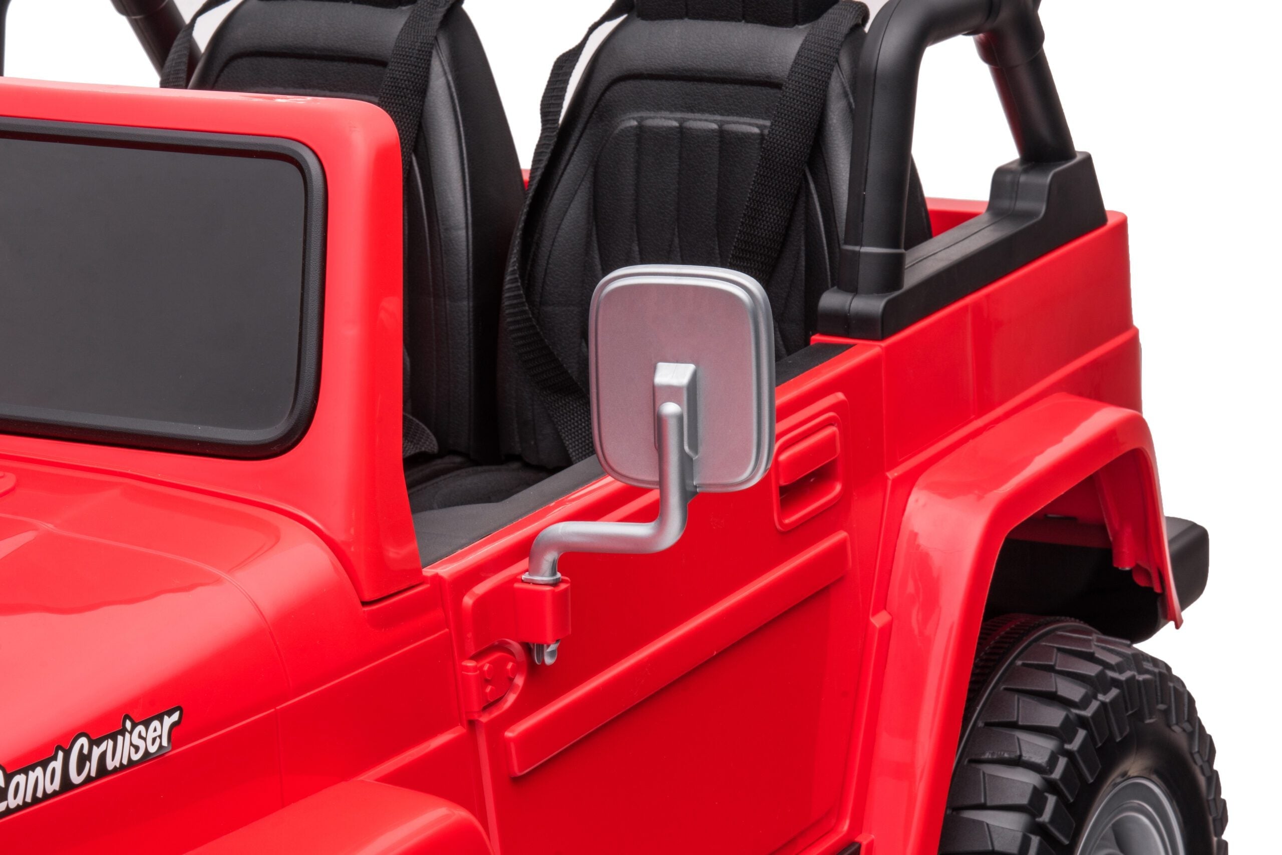 Close-up of red Licensed Toyota FJ40 LandCruiser kids 2-seater ride-on SUV showing seats and side mirror detail