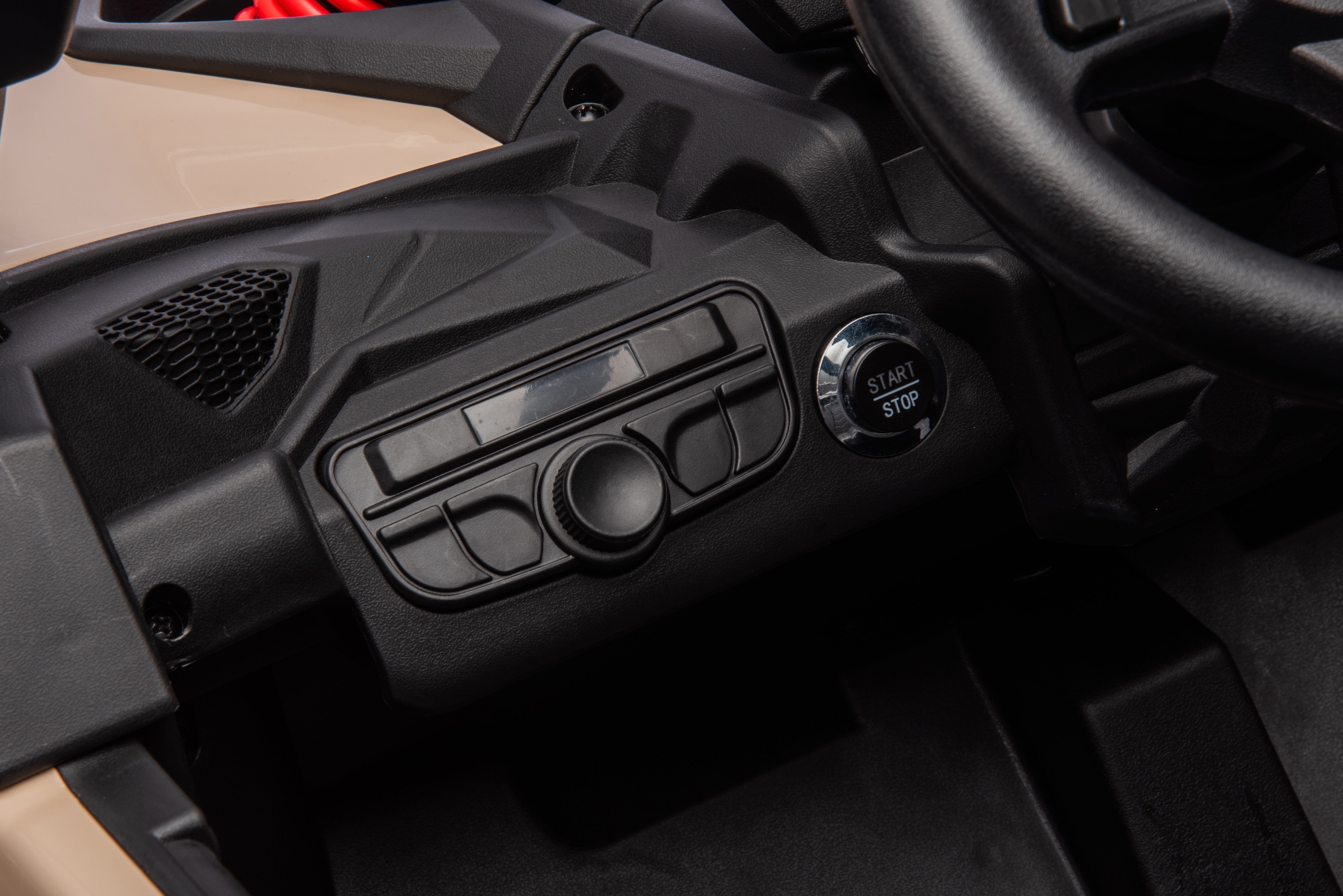 Close-up of dashboard controls and start/stop button in Licensed Can-Am Maverick 24V Kids Ride-On UTV Car pink model