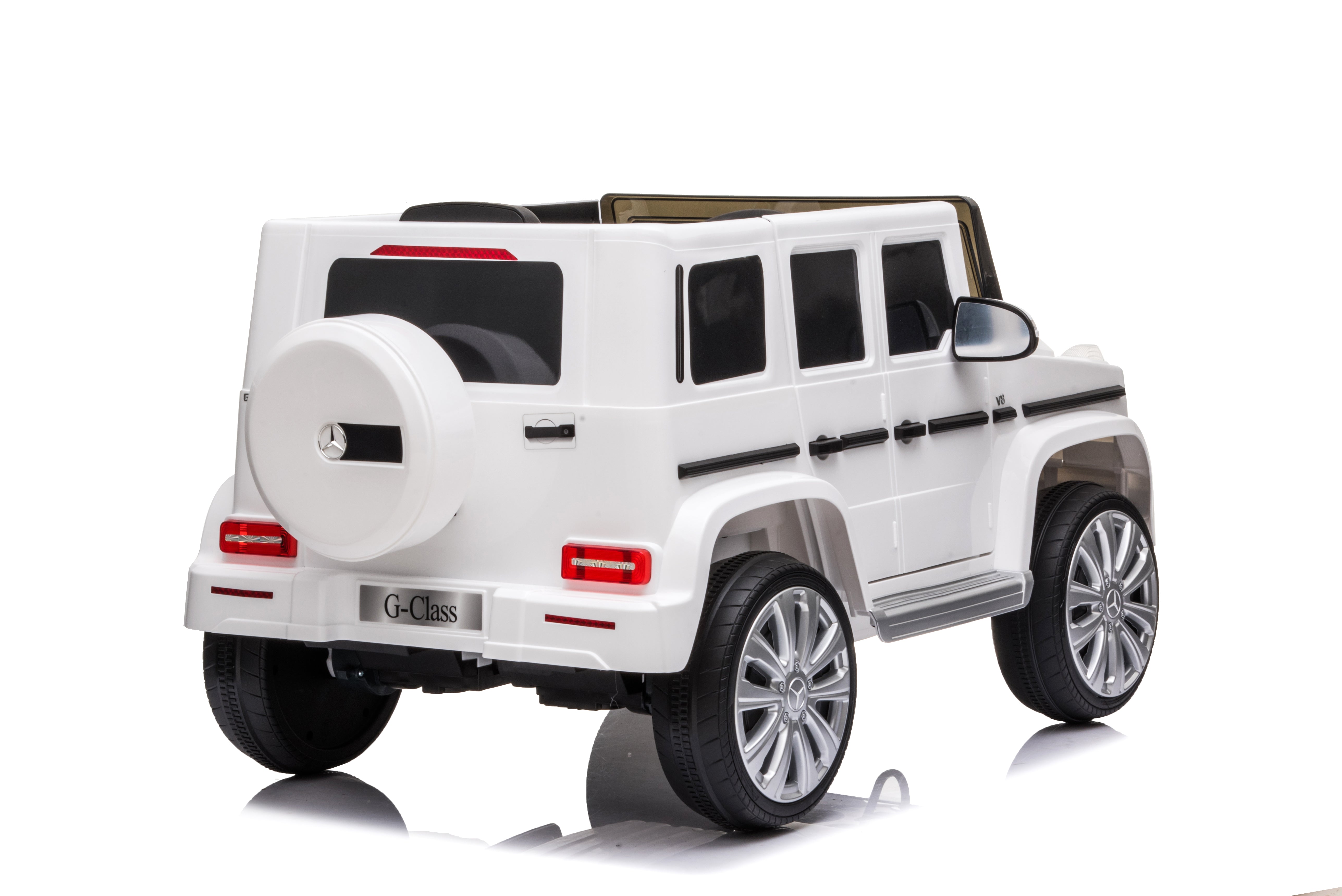 White 12V licensed Mercedes G-Wagon G63 kids electric ride-on car viewed from the rear on a white background