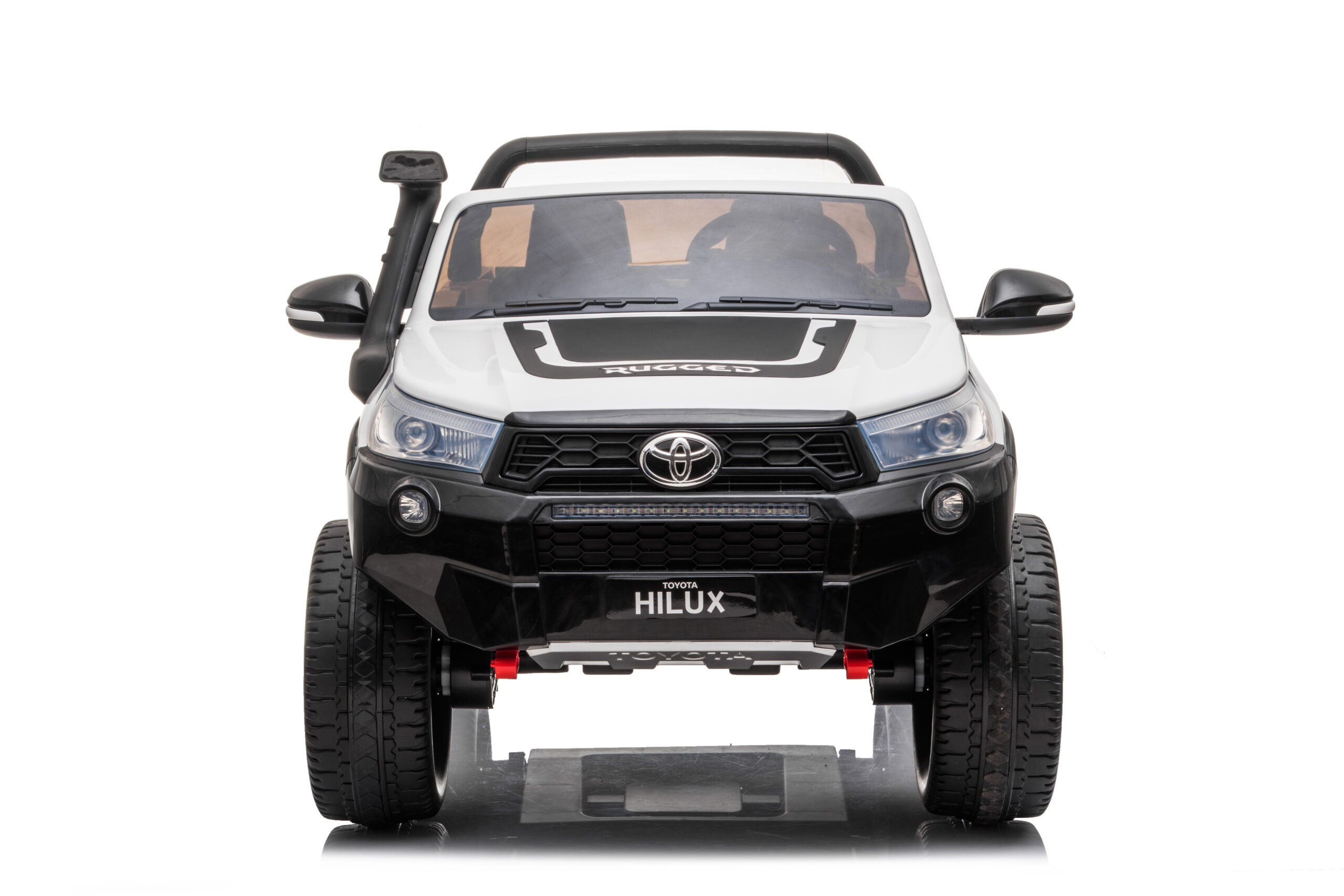 Front view of white licensed Toyota Hilux 24V kids 2-seater ride-on car with rugged design and LED headlights