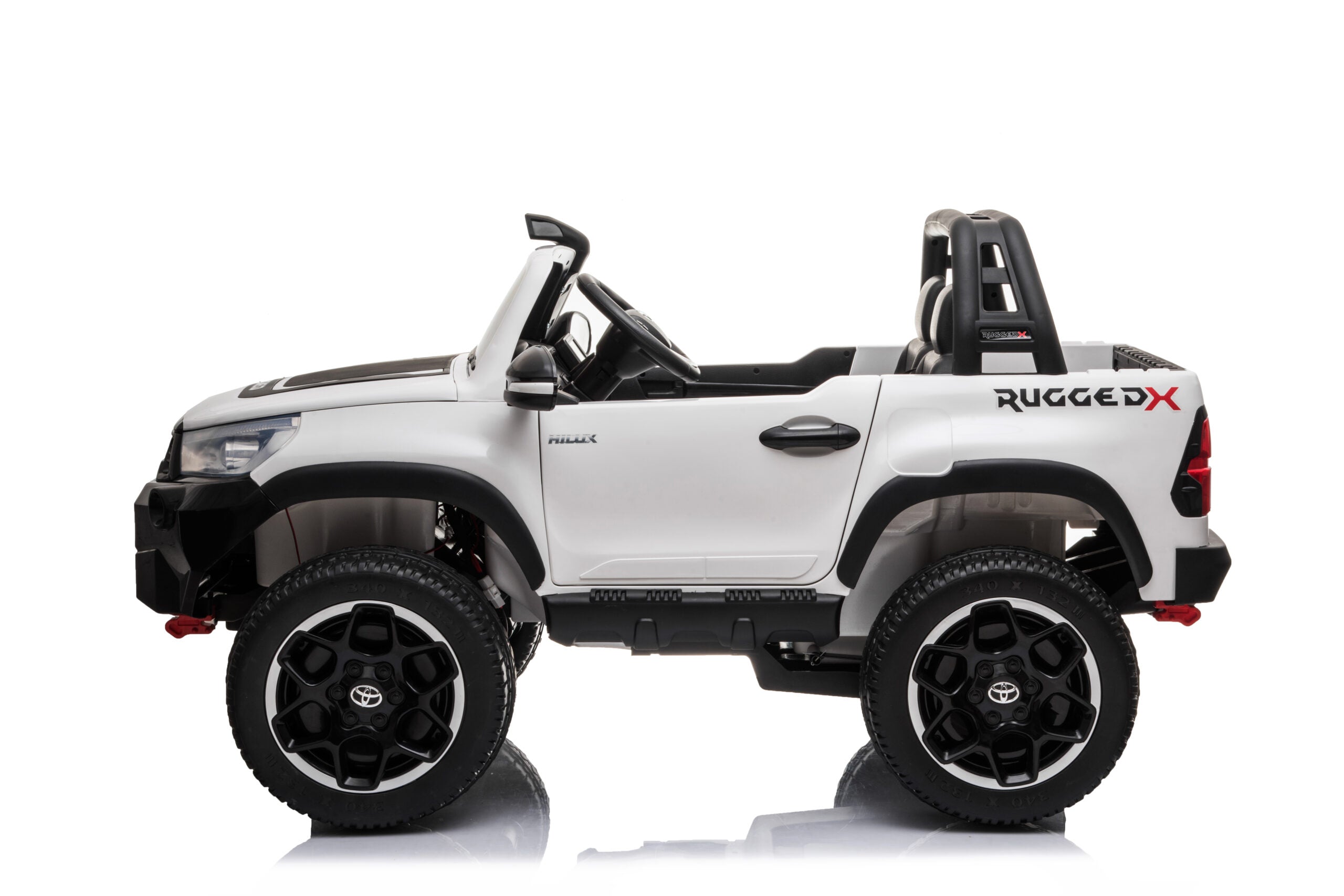 White licensed Toyota Hilux Rugged 24V kids ride-on car with 4x4, two seats, and off-road style tires
