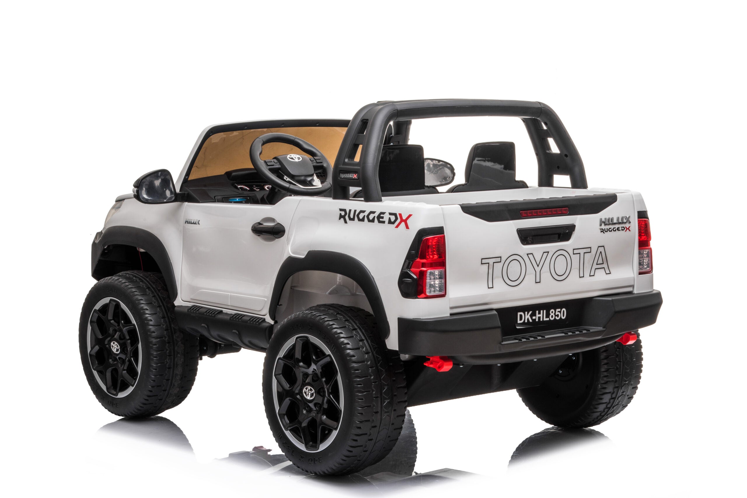 White Licensed Toyota Hilux Rugged 24V kids ride-on car with 4x4 wheels, two seats, and realistic design features