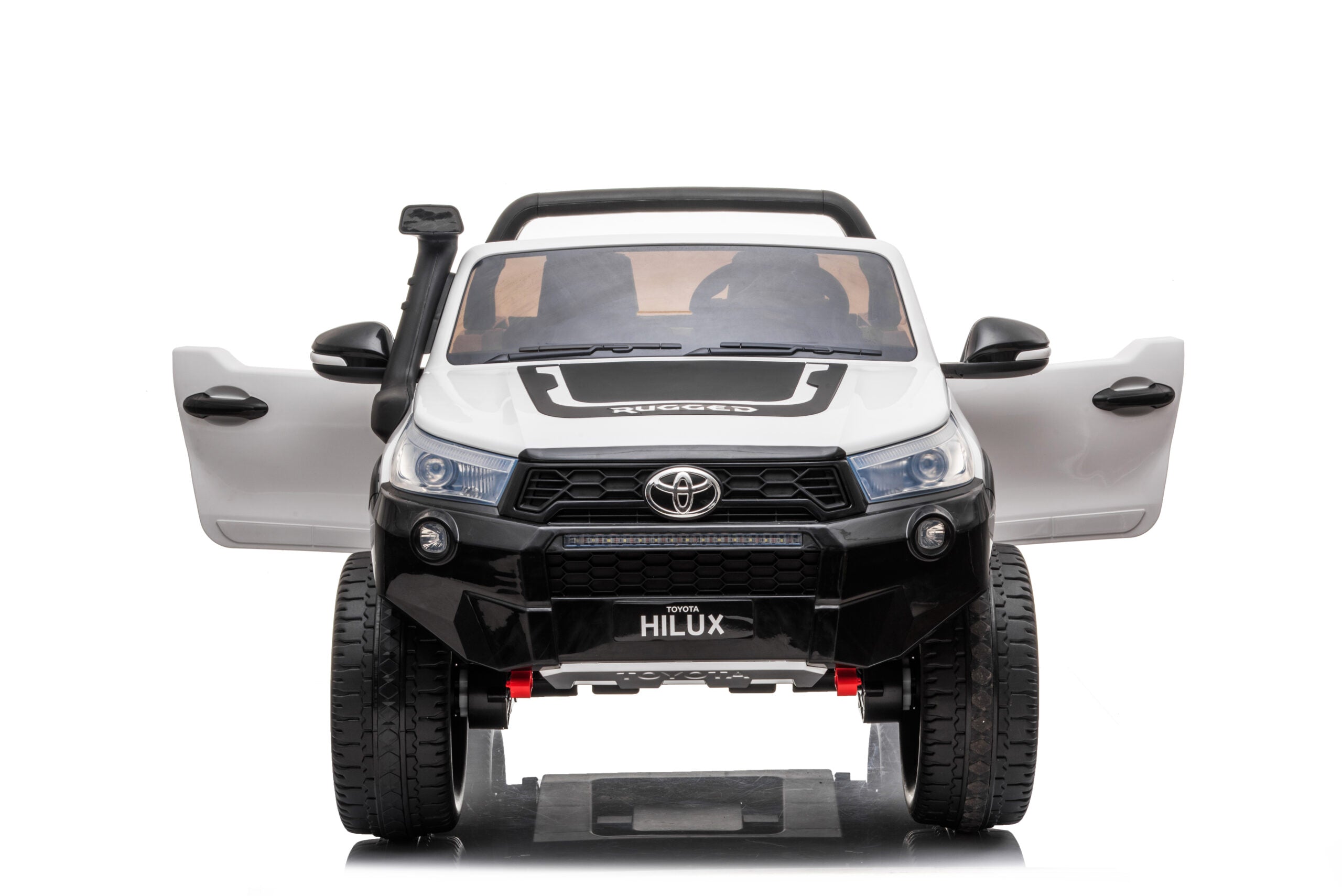 White Licensed Toyota Hilux Rugged 24V kids ride-on car with open doors, realistic design, and off-road tires.
