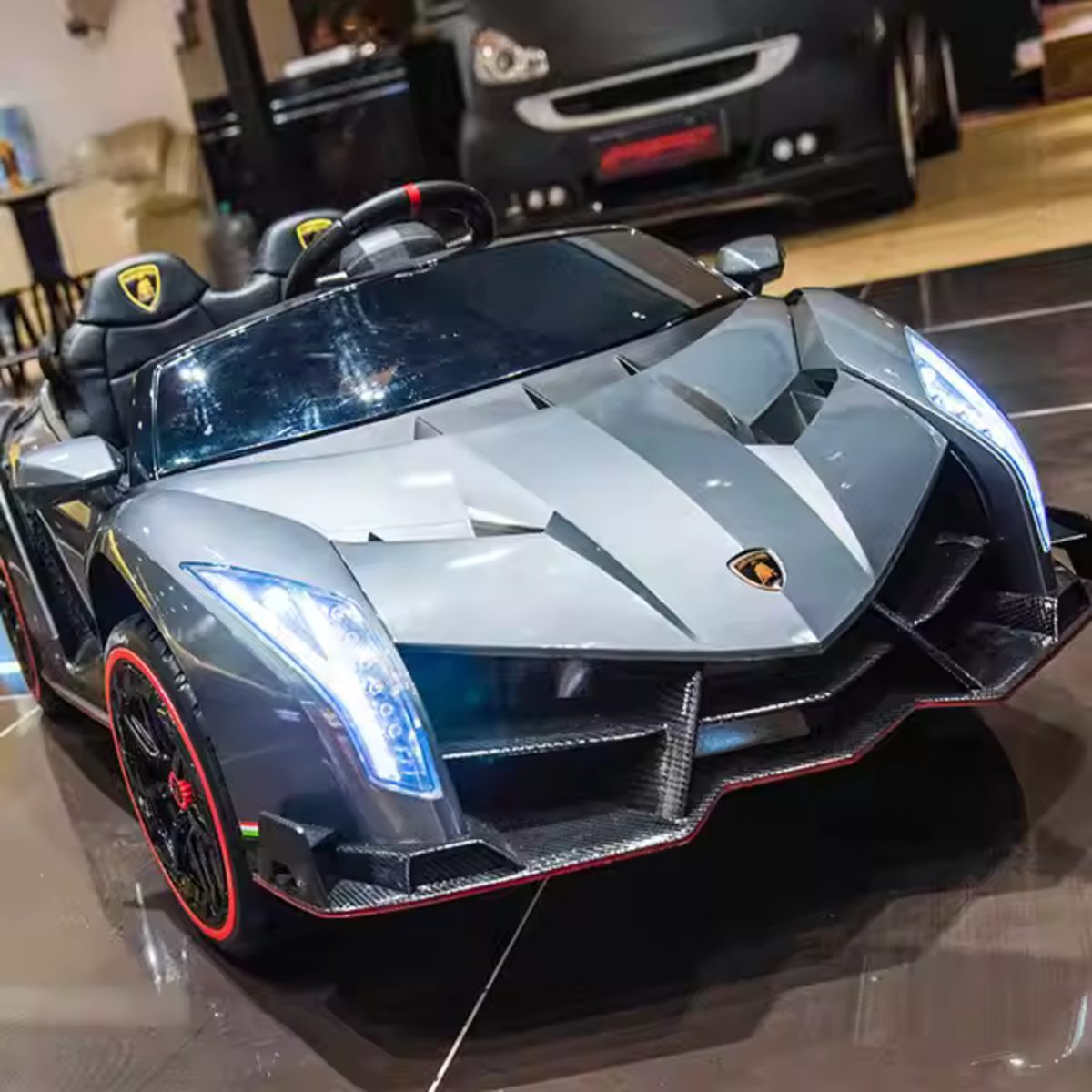 Silver Licensed Lamborghini Veneno 12V kids ride-on car with LED headlights and detailed sports design