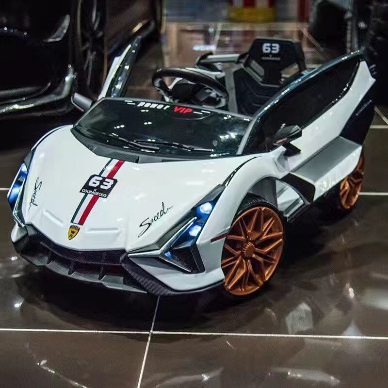 White Lamborghini-inspired kids ride-on car with scissor doors, racing stripes, and bronze wheels for ages 3 and up.