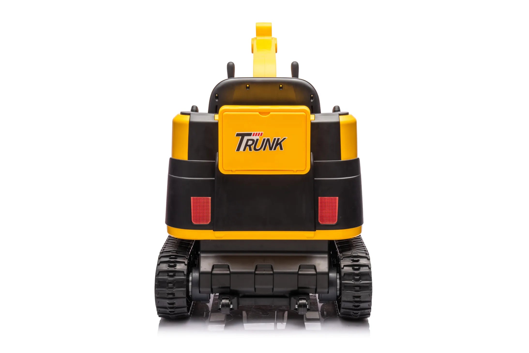 Rear view of yellow 24V kids ride-on excavator digger with tracked wheels and manual arm controls on white background