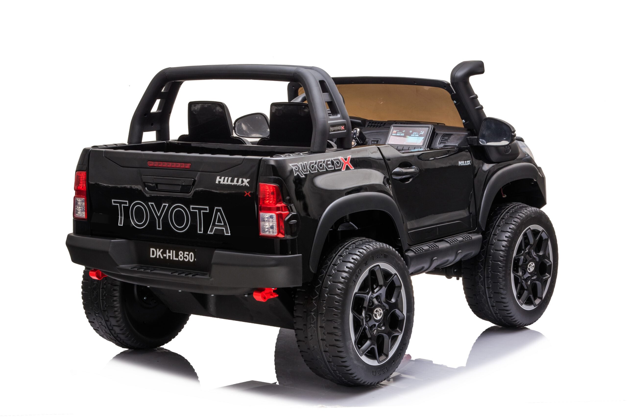Black licensed Toyota Hilux Rugged 24V kids ride-on car with 2 leather seats and off-road EVA rubber tires.