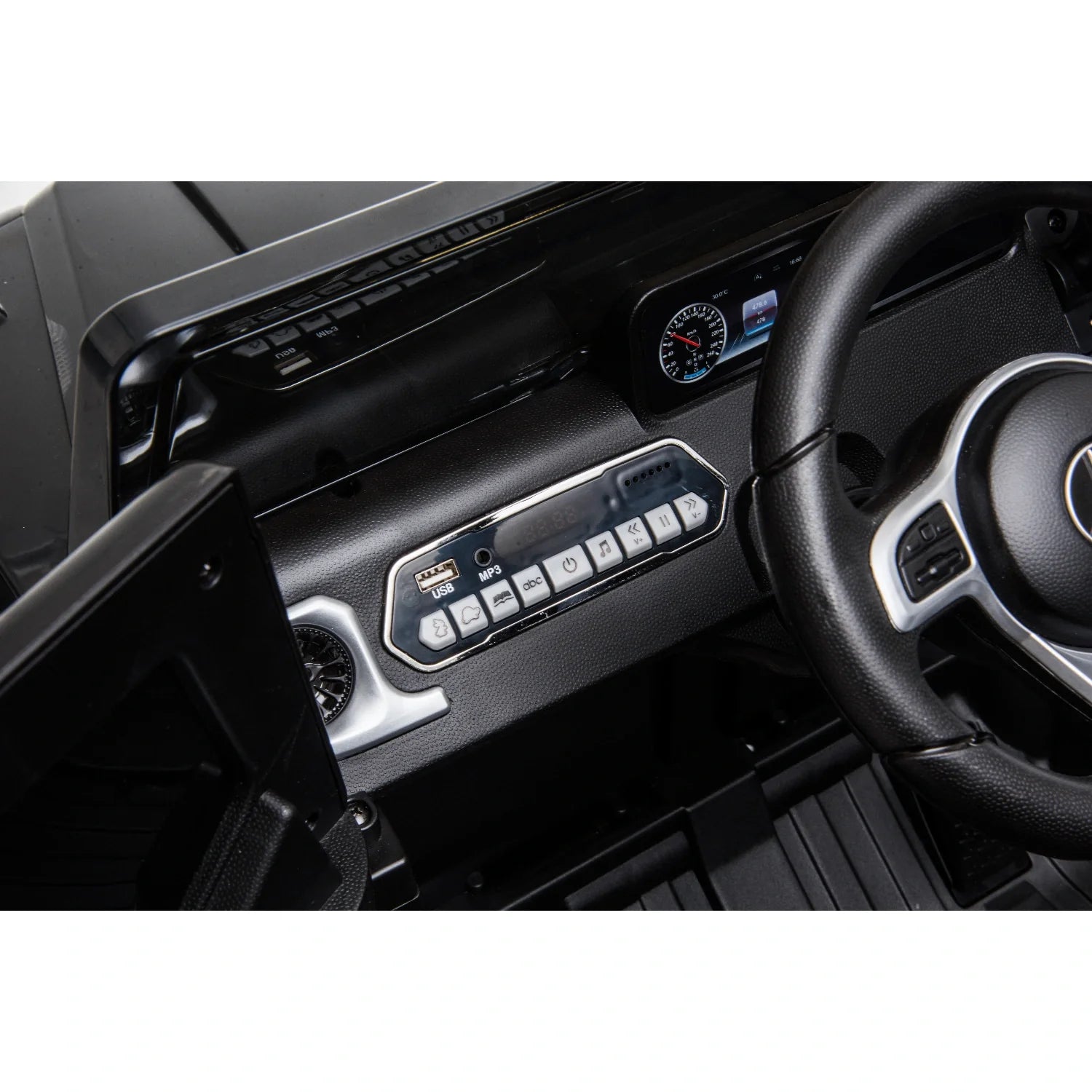 Close-up of the dashboard and steering wheel inside a black 12V licensed Mercedes G-Wagon G63 kids ride-on car