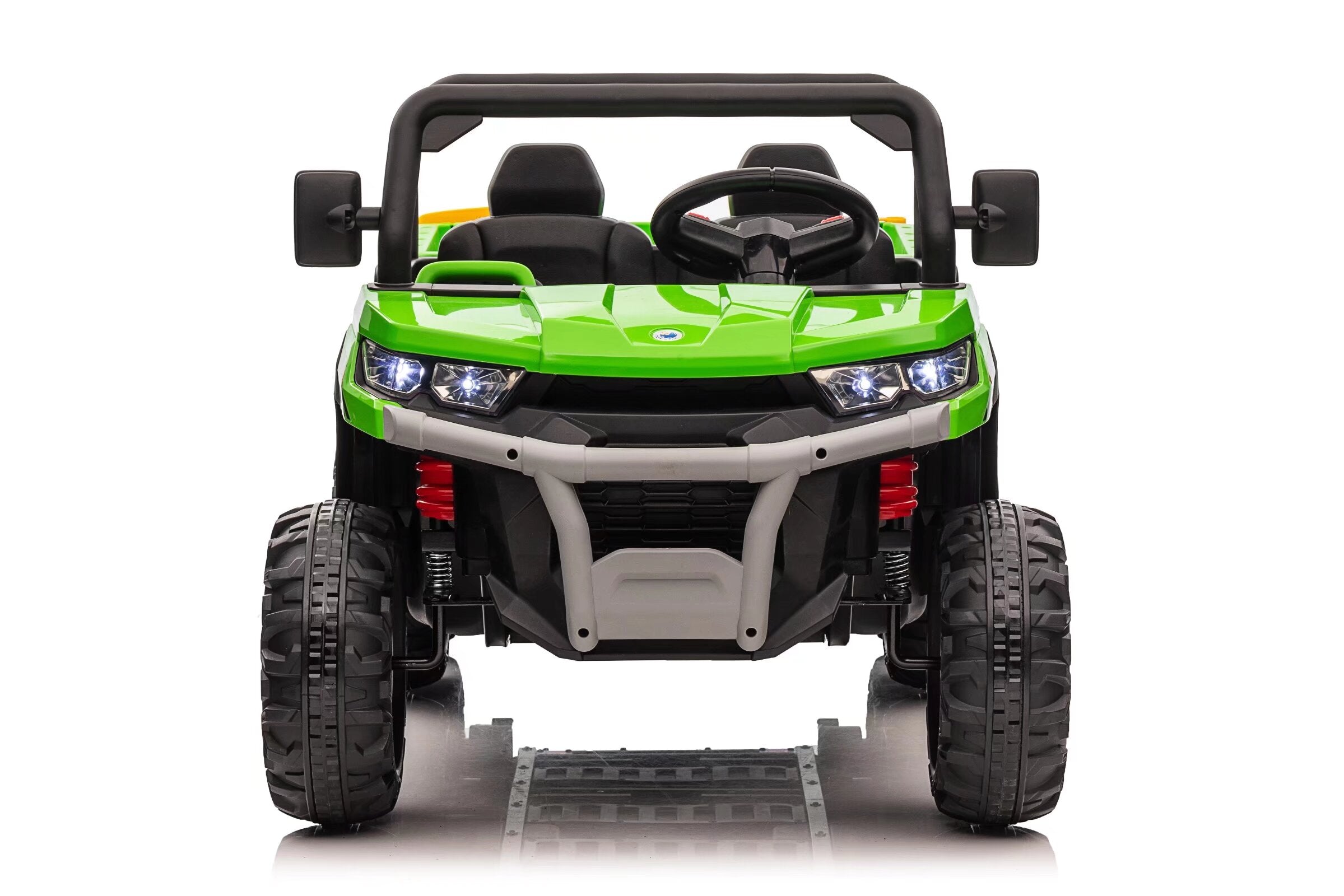 Front view of a green 24V kids electric ride-on dump truck with dual seats and six-wheel drive system