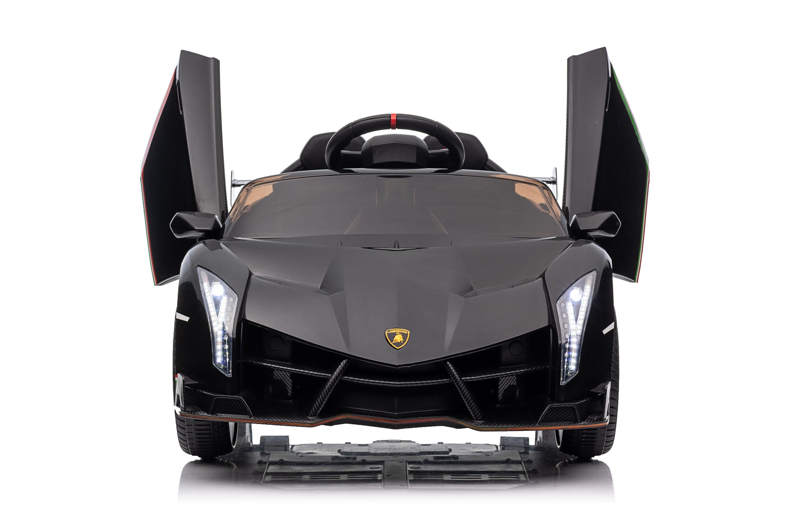 Front view of black Lamborghini Veneno ride-on car for kids with scissor doors open and LED headlights on
